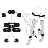 BDSM bondage set vrat, ruke, noge – crna koža i zlatni lanci za igru moći